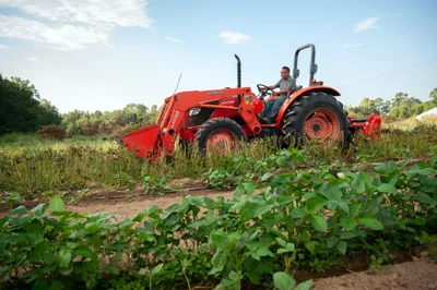 Vicente Gonzalez moves his tractor at his farm in Bodcaw, Ark. on Sept. 7, 2023. Photo by Rory Doyle.